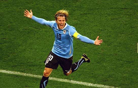 Golden ball award winner Forlan celebrating the first goal against Netherlands in Semi Final Forlan scoring against Netherlands in Semi Final